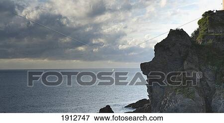 one lone sailboat in the ocean off the coast; liguria, italy View Large Photo Image Stock Photo - one lone sailboat in the ocean off the coast; liguria, italy. Fotosearch