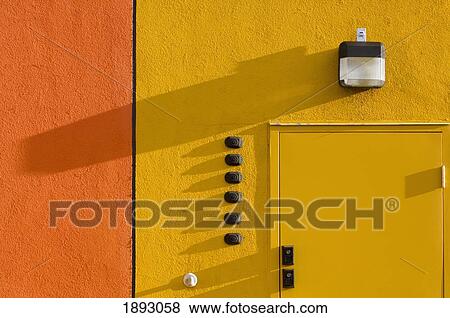 orange and yellow stucco door with a door and a light; st. albert, alberta, canada View Large Photo Image Stock Photo - orange and yellow stucco door with a door and a light; st. albert, alberta, canada. Fotosearch