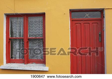 Stock Photo - painted house in west cork in munster region; unionhall, county cork, ireland. Fotosearch