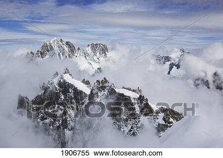 peaks of a snowy mountain range; chamonix, france View Large Photo Image Stock Photography - peaks of a snowy mountain range; chamonix, france. Fotosearch