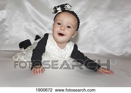 portrait of a baby girl wearing a head band; portland, oregon, united states of america View Large Photo Image Stock Image - portrait of a baby girl wearing a head band; portland, oregon, united states of america. Fotosearch