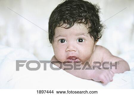 Picture - portrait of a baby with a full head of dark hair; troutdale, oregon, united states of america. Fotosearch