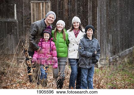 portrait of a family in a snowfall; grimsby, ontario, canada View Large Photo Image Stock Photograph - portrait of a family in a snowfall; grimsby, ontario, canada. Fotosearch