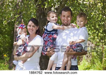 Stock Image - portrait of a family with three children; portland, oregon, united states of america. Fotosearch