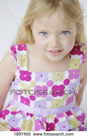 Stock Photography - portrait of a girl with long, blond hair and blue eyes; troutdale, oregon, united states of america. Fotosearch