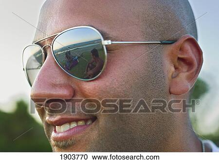 portrait of a man wearing sunglasses with a reflection of the beach and ocean; tarifa, cadiz, andalusia, spain View Large Photo Image Stock Image - portrait of a man wearing sunglasses with a reflection of the beach and ocean; tarifa, cadiz, andalusia, spain. Fotosearch
