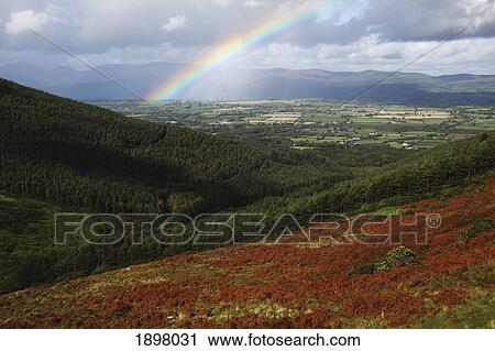 Stock Image - rainbow over the vee in munster province; county tipperary, ireland. Fotosearch