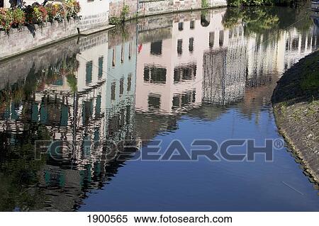 reflection of medieval timber style buildings and blue sky in the canal; strasbourg, france View Large Photo Image Stock Photography - reflection of medieval timber style buildings and blue sky in the canal; strasbourg, france. Fotosearch