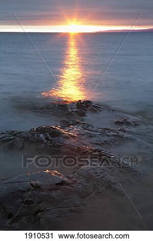 rocky shoreline of lake superior at sunset; wawa, ontario, canada View Large Photo Image Stock Image - rocky shoreline of lake superior at sunset; wawa, ontario, canada. Fotosearch