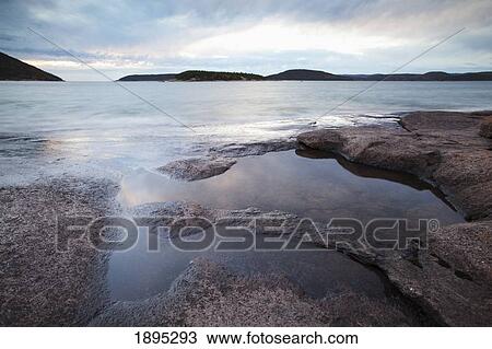 Stock Image - rocky shoreline of lake superior; marathon, ontario, canada. Fotosearch