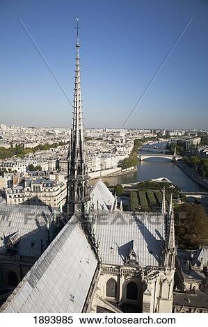 roof tops of the back side of notre-dame cathedral with a spire; paris, france View Large Photo Image Stock Photography - roof tops of the back side of notre-dame cathedral with a spire; paris, france. Fotosearch