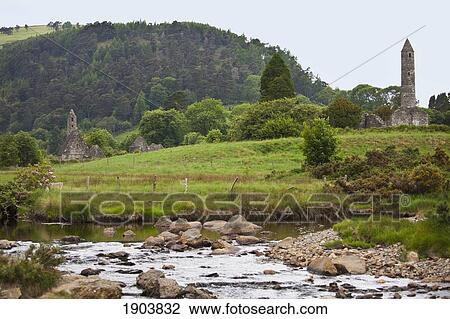 ruins of a building and a round tower on a 6th century monastic site; glendalough, county wicklow, ireland View Large Photo Image Stock Image - ruins of a building and a round tower on a 6th century monastic site; glendalough, county wicklow, ireland. Fotosearch