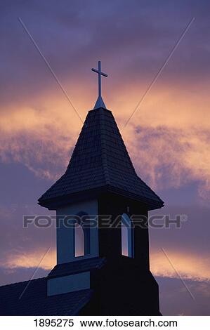 silhouette of a church steeple with a colourful sky at sunrise; calgary, alberta, canada View Large Photo Image Stock Photography - silhouette of a church steeple with a colourful sky at sunrise; calgary, alberta, canada. Fotosearch