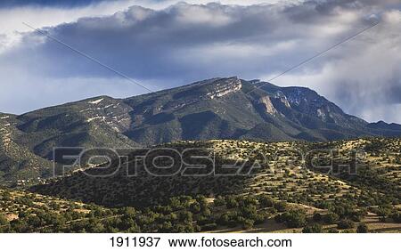 Stock Photo - storm passes over the sandia mountains, viewed from placitas; new mexico, united states of america. Fotosearch
