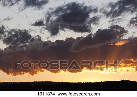 sunbeams radiating from a sunset; new mexico, united states of america View Large Photo Image Picture - sunbeams radiating from a sunset; new mexico, united states of america. Fotosearch