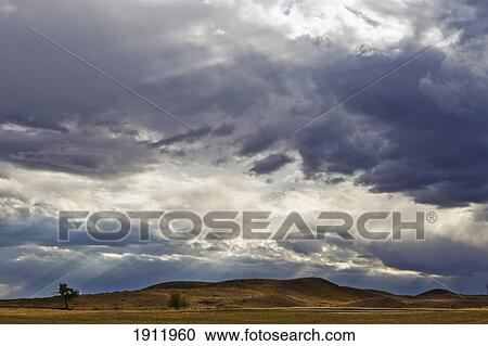 sunlight through dark clouds View Large Photo Image Stock Image - sunlight through dark clouds. Fotosearch