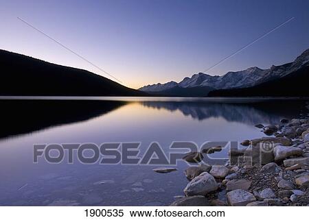 Stock Photography - sunrise on the upper lake of kananaskis; alberta, canada. Fotosearch