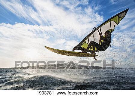 surfing with a sail on the ocean; tarifa, cadiz, andalusia, spain View Large Photo Image Stock Image - surfing with a sail on the ocean; tarifa, cadiz, andalusia, spain. Fotosearch