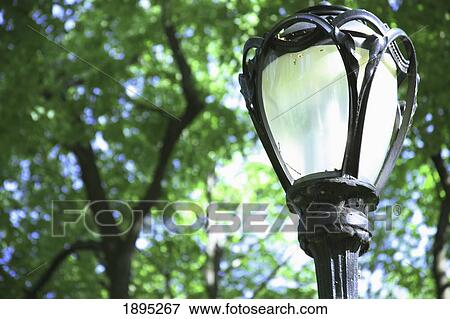 Stock Photo - the top of a lamp post; manhattan, new york city, new york, united states of america. Fotosearch