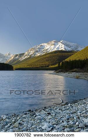 the upper lake at sunrise; kananaskis, alberta, canada View Large Photo Image Stock Image - the upper lake at sunrise; kananaskis, alberta, canada. Fotosearch