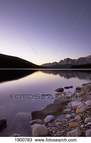 the upper lake at sunrise; kananaskis, alberta, canada View Large Photo Image Stock Image - the upper lake at sunrise; kananaskis, alberta, canada. Fotosearch