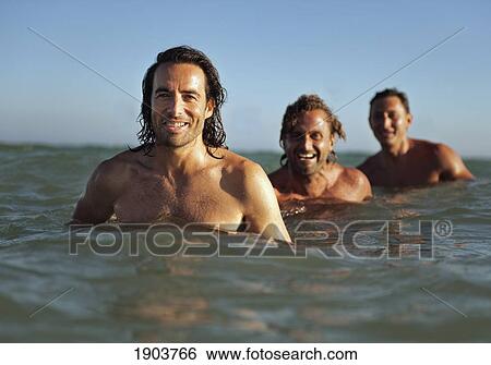 three men in the ocean; tarifa, cadiz, andalusia, spain View Large Photo Image Stock Photograph - three men in the ocean; tarifa, cadiz, andalusia, spain. Fotosearch