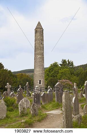 tombstones in a cemetery and a round tower on a 6th century monastic site; glendalough, county wicklow, ireland View Large Photo Image Stock Photo - tombstones in a cemetery and a round tower on a 6th century monastic site; glendalough, county wicklow, ireland. Fotosearch