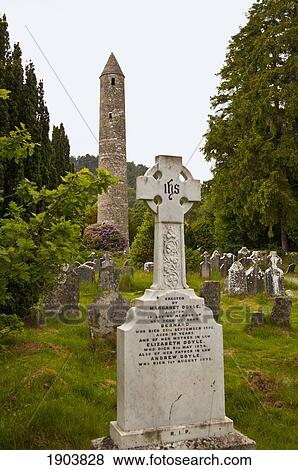 tombstones in a cemetery and a round tower on a 6th century monastic site; glendalough, county wicklow, ireland View Large Photo Image Stock Photo - tombstones in a cemetery and a round tower on a 6th century monastic site; glendalough, county wicklow, ireland. Fotosearch