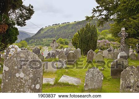 tombstones in a cemetery on a 6th century monastic site; glendalough, county wicklow, ireland View Large Photo Image Stock Photo - tombstones in a cemetery on a 6th century monastic site; glendalough, county wicklow, ireland. Fotosearch