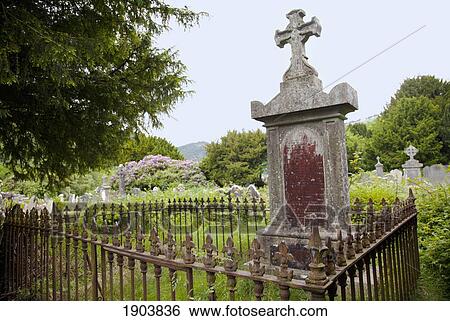 Stock Photograph - tombstones in a cemetery on a 6th century monastic site; glendalough, county wicklow, ireland. Fotosearch