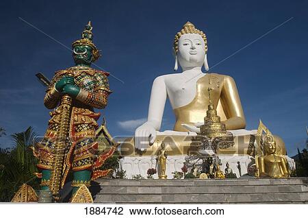 wat doi kham temple statue with guardian giant; chiang mai, thailand View Large Photo Image Stock Image - wat doi kham temple statue with guardian giant; chiang mai, thailand. Fotosearch