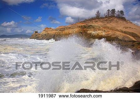 Stock Photo - waves crashing on the rock along the shore of cape kiwanda in cape kiwanda national park; oregon, united states of america. Fotosearch