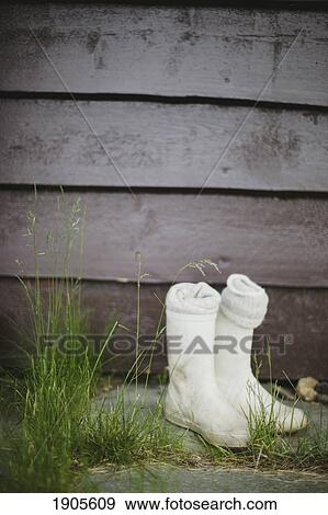 white boots outside a wood cabin; vang, norway View Large Photo Image Stock Photo - white boots outside a wood cabin; vang, norway. Fotosearch