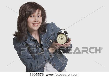 woman focusing on the time View Large Photo Image Stock Photograph - woman focusing on the time. Fotosearch