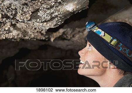 woman inspecting cave popcorn; fernie, british columbia, canada View Large Photo Image Stock Image - woman inspecting cave popcorn; fernie, british columbia, canada. Fotosearch