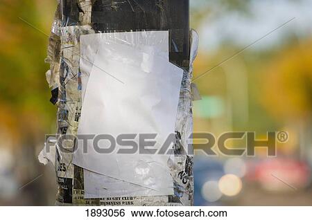 Stock Photograph - wooden post with numerous signs on it; st. albert, alberta, canada. Fotosearch