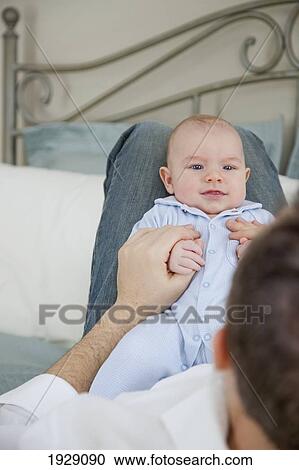 a father looking at his baby; jordan, ontario, canada View Large Photo Image Stock Image - a father looking at his baby; jordan, ontario, canada. Fotosearch