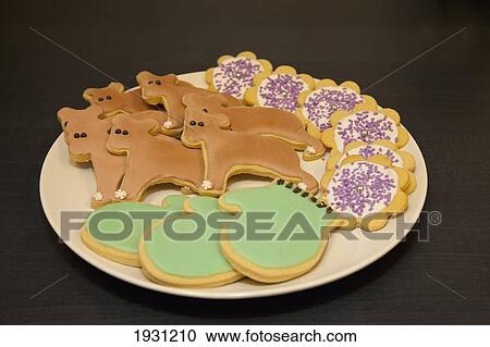 Stock Image - a homemade plate of decorative frosted cookies. Fotosearch