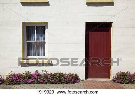 A House With A Red Door; Glenbeigh, County Kerry, Ireland View Large Photo Image Stock Photo - A House With A Red Door; Glenbeigh, County Kerry, Ireland. Fotosearch