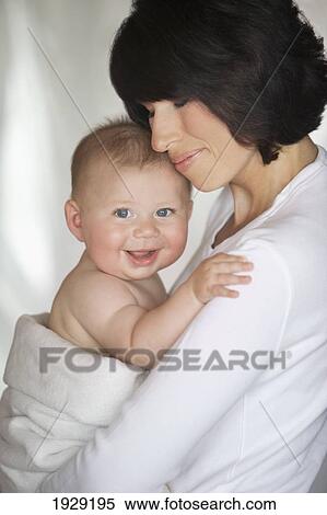 a mother holding her baby View Large Photo Image Stock Photography - a mother holding her baby. Fotosearch