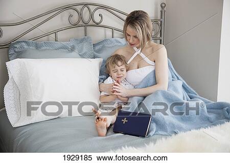 a mother praying with her toddler son View Large Photo Image Stock Photography - a mother praying with her toddler son. Fotosearch