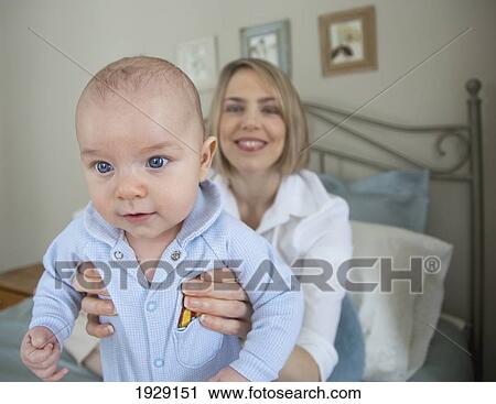 a proud mother holding her baby; jordan, ontario, canada View Large Photo Image Stock Image - a proud mother holding her baby; jordan, ontario, canada. Fotosearch