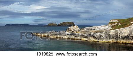 Ballintoy Harbour With Rathlin Island In The Distance; Ballintoy, County Antrim, Northern Ireland View Large Photo Image Stock Photography - Ballintoy Harbour With Rathlin Island In The Distance; Ballintoy, County Antrim, Northern Ireland. Fotosearch