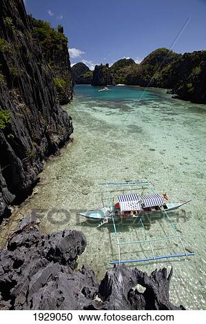 bangka boats in the small lagoon on miniloc island, near el nido; bacuit archipelago, palawan, philippines View Large Photo Image Stock Image - bangka boats in the small lagoon on miniloc island, near el nido; bacuit archipelago, palawan, philippines. Fotosearch