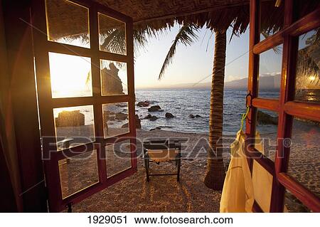 Stock Image - beach view from resort window; apo island, philippines. Fotosearch