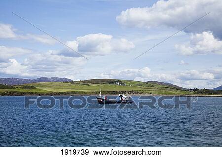 Boat Off The Coast Of Connemara; Cleggan, County Galway, Ireland View Large Photo Image Stock Photo - Boat Off The Coast Of Connemara; Cleggan, County Galway, Ireland. Fotosearch