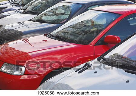Stock Photo - cars parked in a line on the street; los boliches, fuengirola, malaga province, costa del sol, spain. Fotosearch