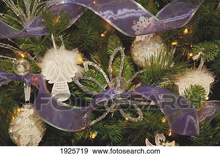 Stock Photo - christmas tree decorated with angels and ribbon; edmonton, alberta, canada. Fotosearch