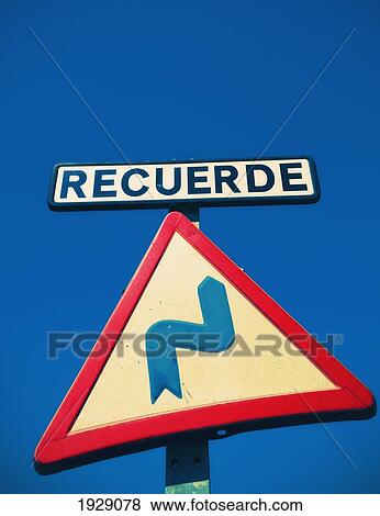 Stock Photo - close-up of road sign warning of winding road; malaga, spain. Fotosearch
