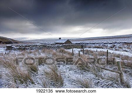 Stock Photography - cloudy sky over snowy field; yorkshire dales, england. Fotosearch